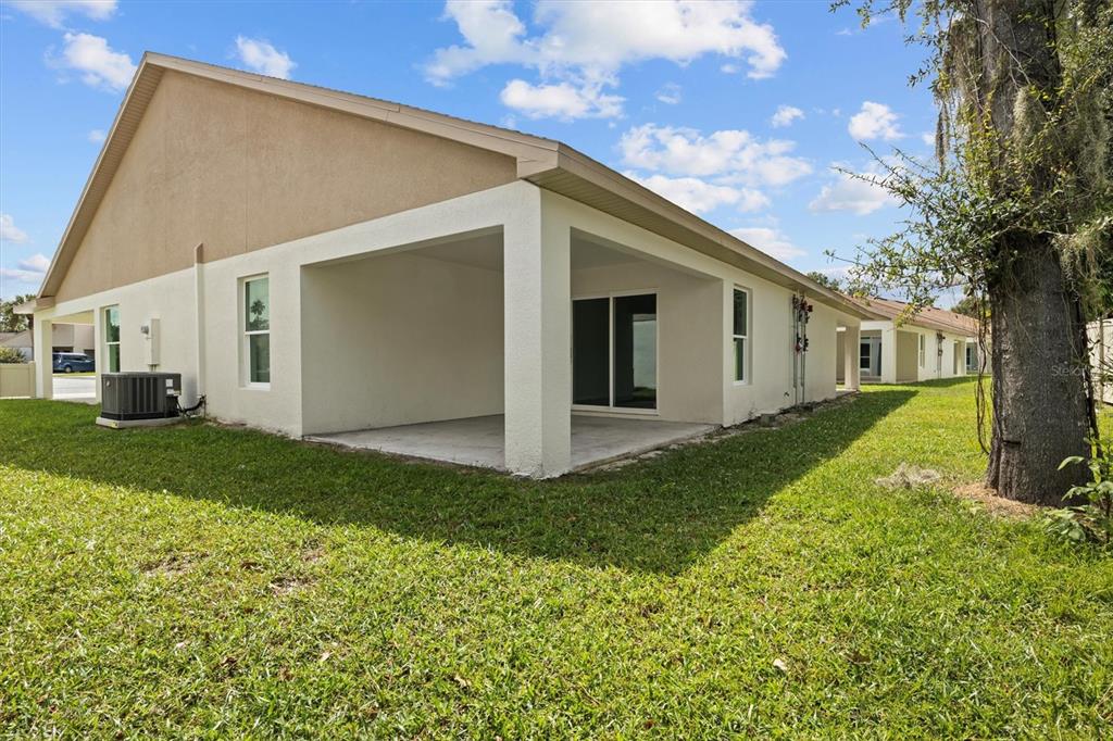 4153 Oak Loop Mulberry, FL 33860 - Photo 11 of 11 a view of a back yard of the house