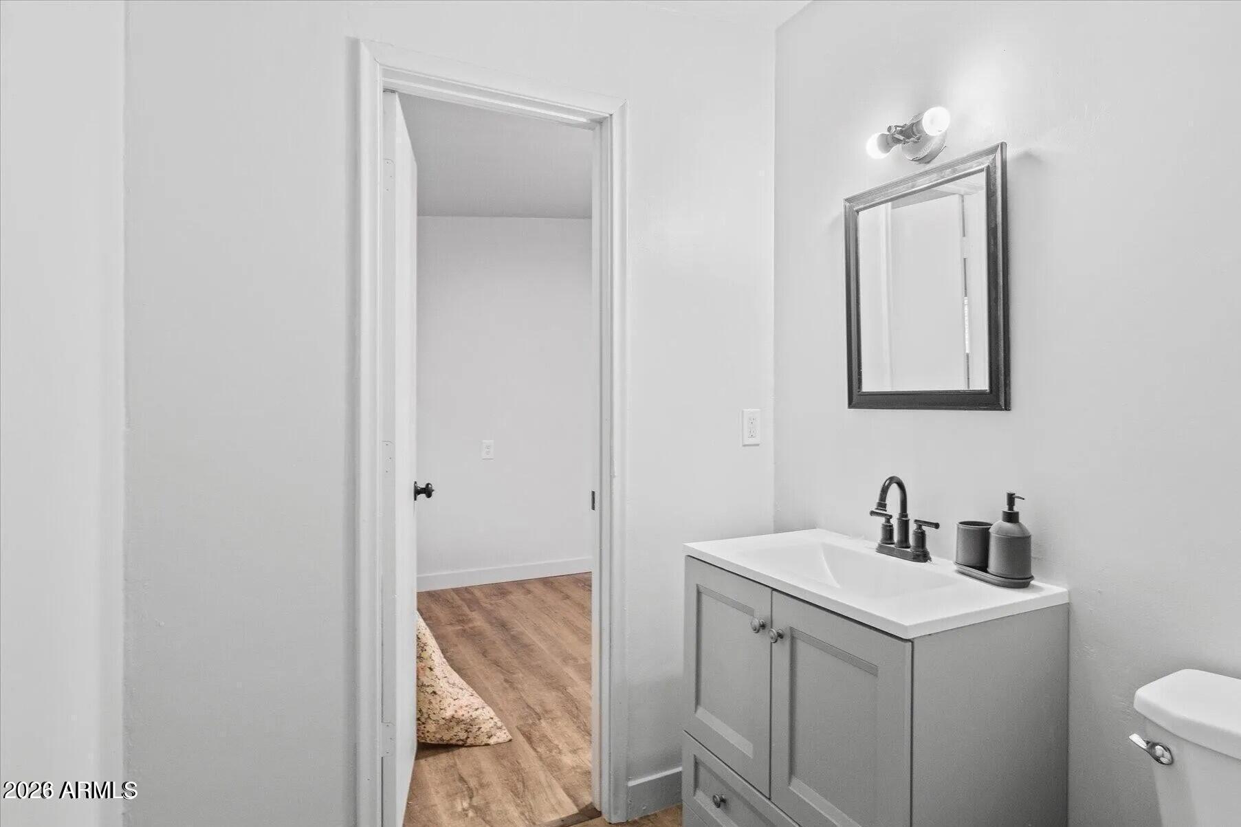 5065 Forest View Road Lakeside, AZ 85929 - Photo 16 of 24 a bathroom with a toilet sink and mirror