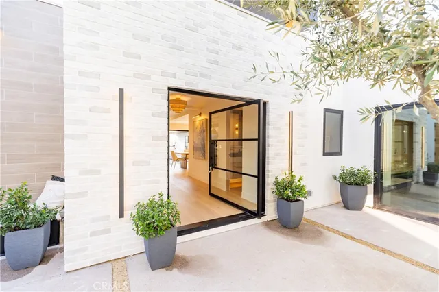a large kitchen with a table and chairs