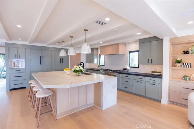 a kitchen with a table and chairs in it