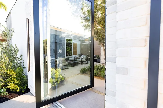 a porch with a bench in front of house