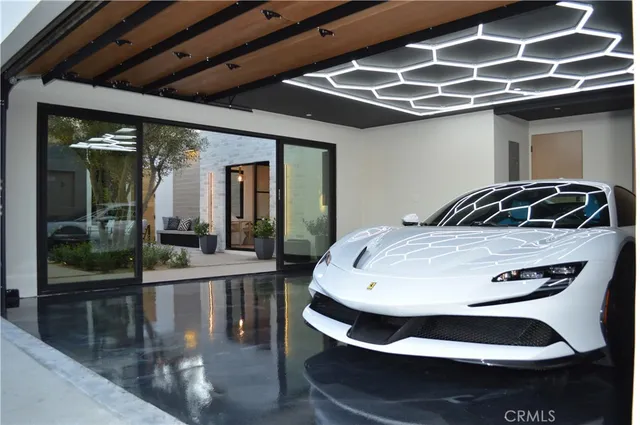 a bedroom with furniture and large windows