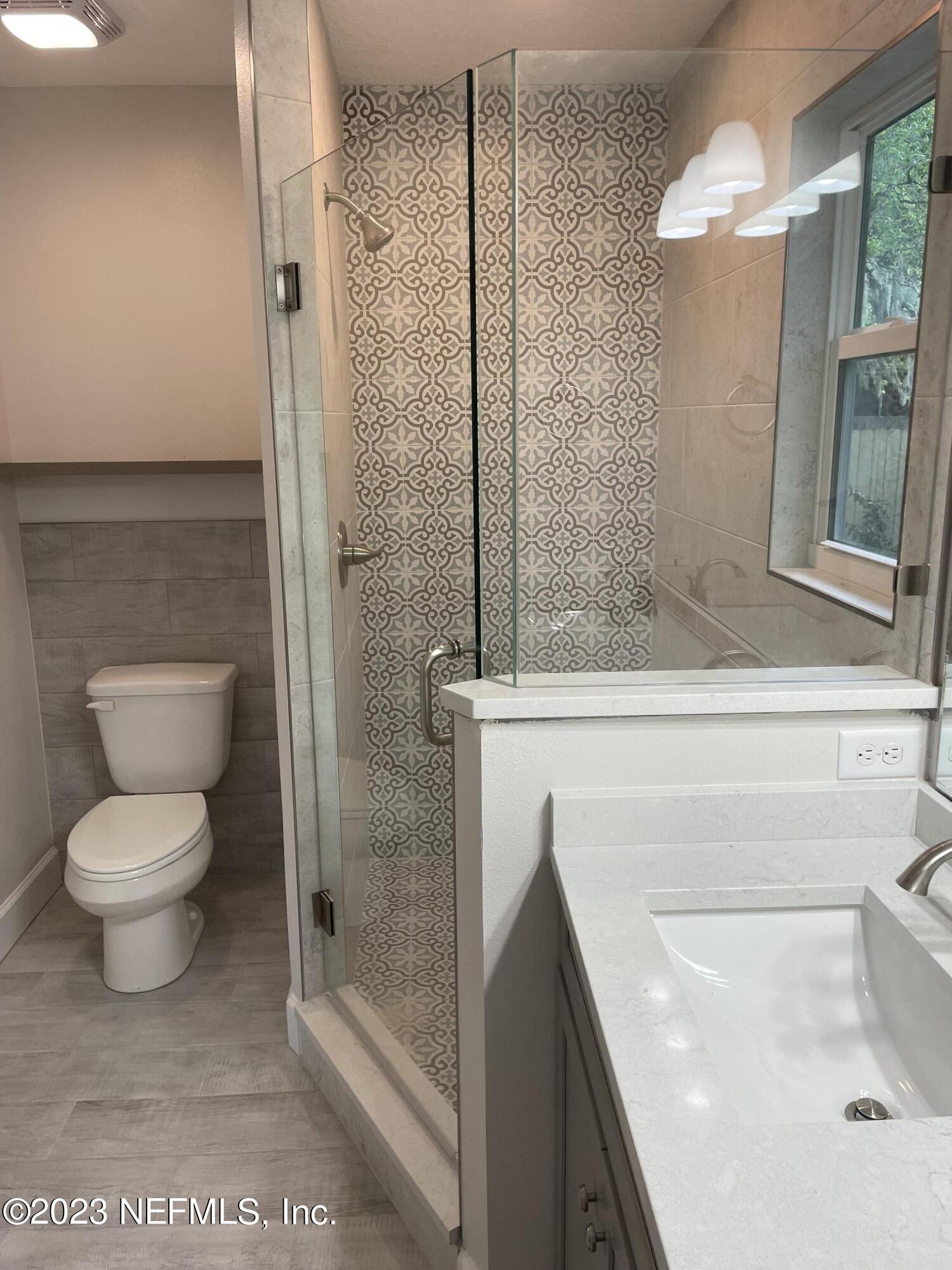 2585 A1A South St. Augustine, FL 32080 - Photo 26 of 37 a bathroom with a toilet and a shower