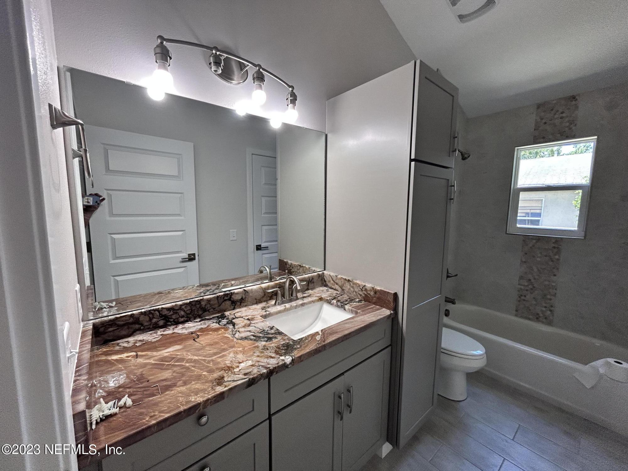 2585 A1A South St. Augustine, FL 32080 - Photo 29 of 37 a bathroom with a granite countertop sink toilet and shower