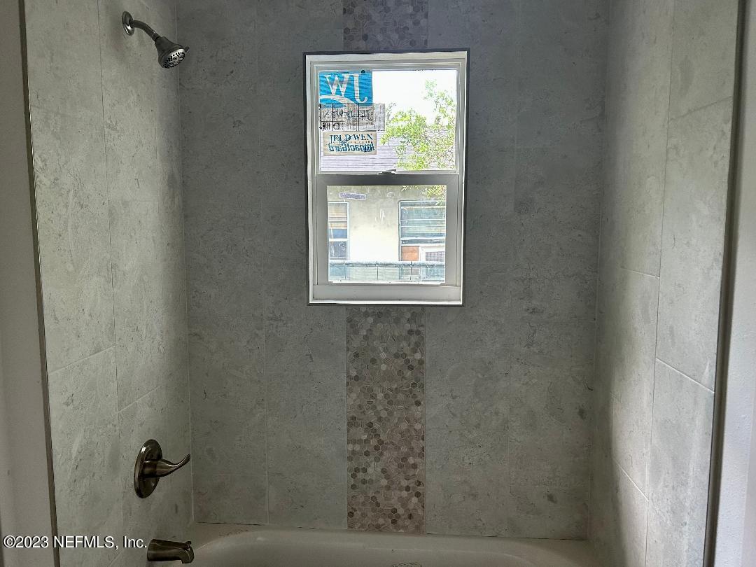 2585 A1A South St. Augustine, FL 32080 - Photo 30 of 37 a bathroom with a window