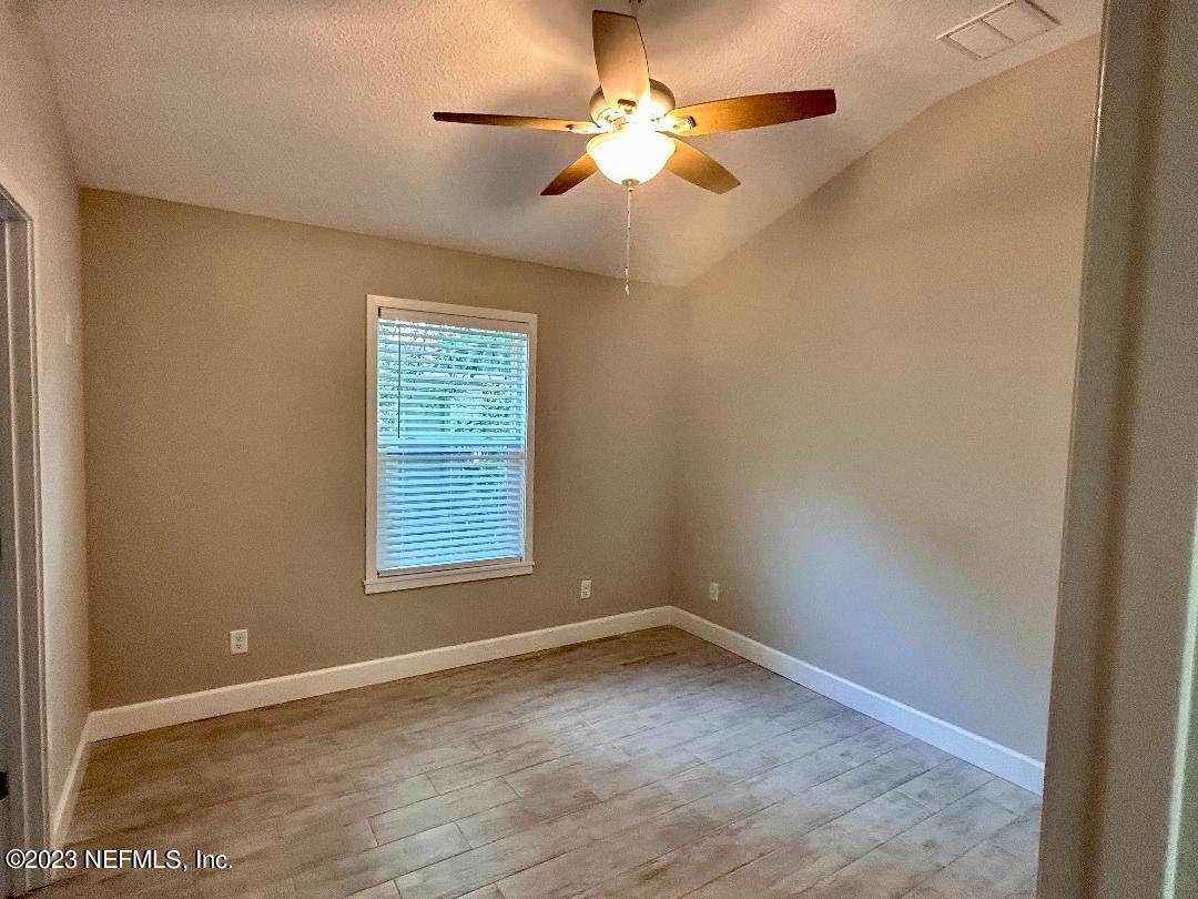2585 A1A South St. Augustine, FL 32080 - Photo 31 of 37 an empty room with a window and a fan