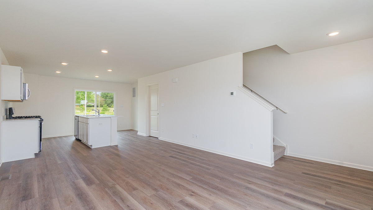 411 Conover Drive Joliet, IL 60421 - Photo 18 of 34 a view of a big room with wooden floor and windows