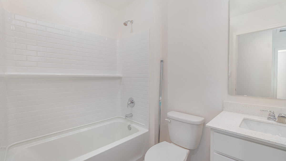 411 Conover Drive Joliet, IL 60421 - Photo 29 of 34 a bathroom with a granite countertop toilet and a sink