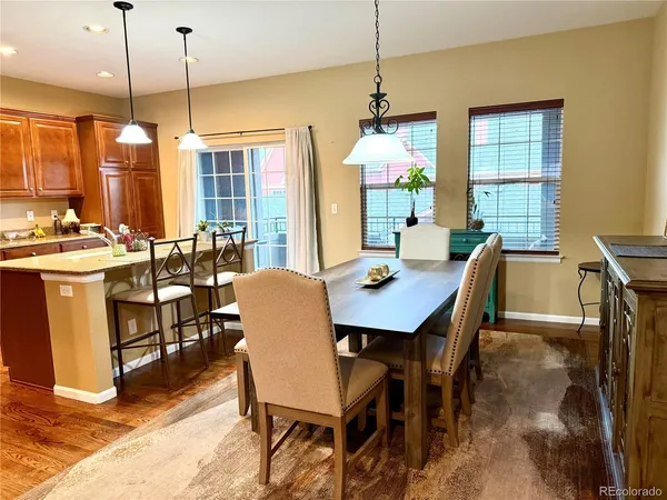 a view of a dining room with furniture window and wooden floor