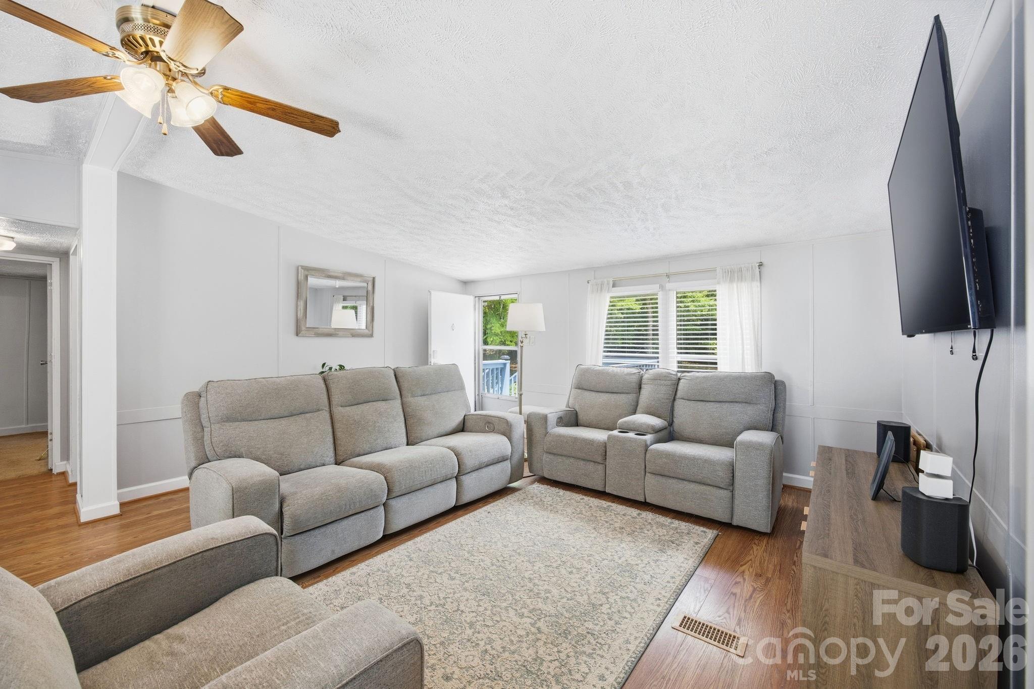 675 Overcash Road Salisbury, NC 28147 - Photo 13 of 48 a living room with furniture a flat screen tv and a window