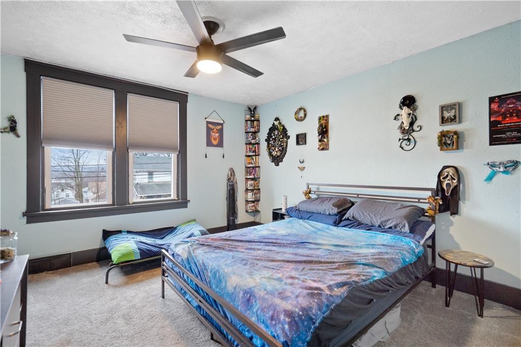 475 Irvin Avenue Rochester, PA 15074 - Photo 12 of 23 a bedroom with a bed and a window