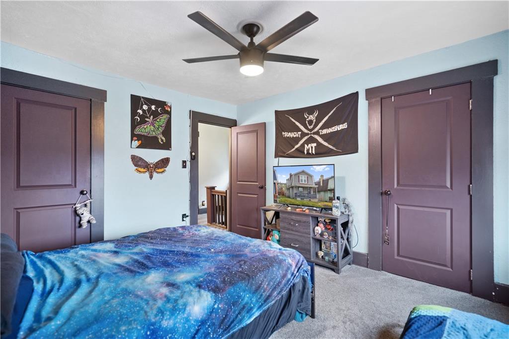 475 Irvin Avenue Rochester, PA 15074 - Photo 13 of 23 a bed room with a bed and a chandelier