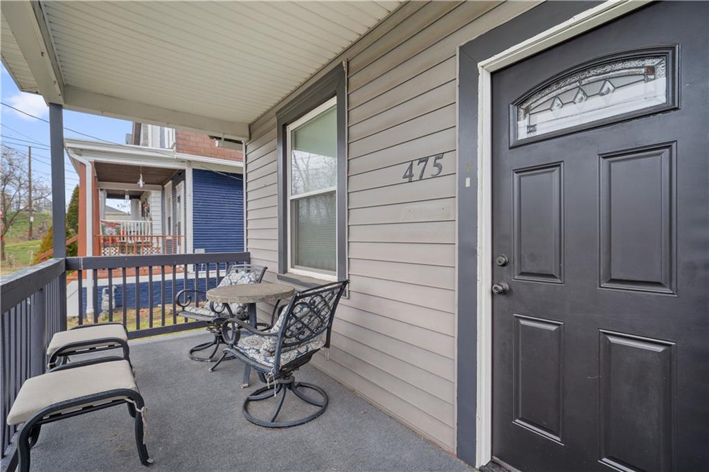 475 Irvin Avenue Rochester, PA 15074 - Photo 3 of 23 a view of a chair and table in the balcony