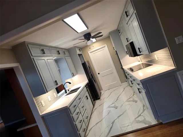 a view of a kitchen with furniture