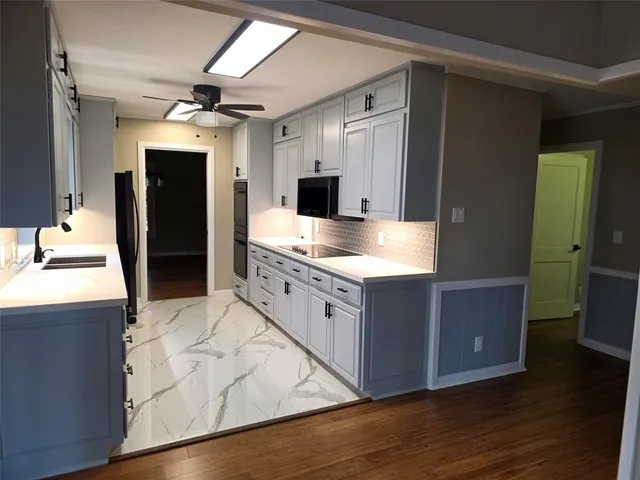 a large bathroom with a large mirror vanity and shower