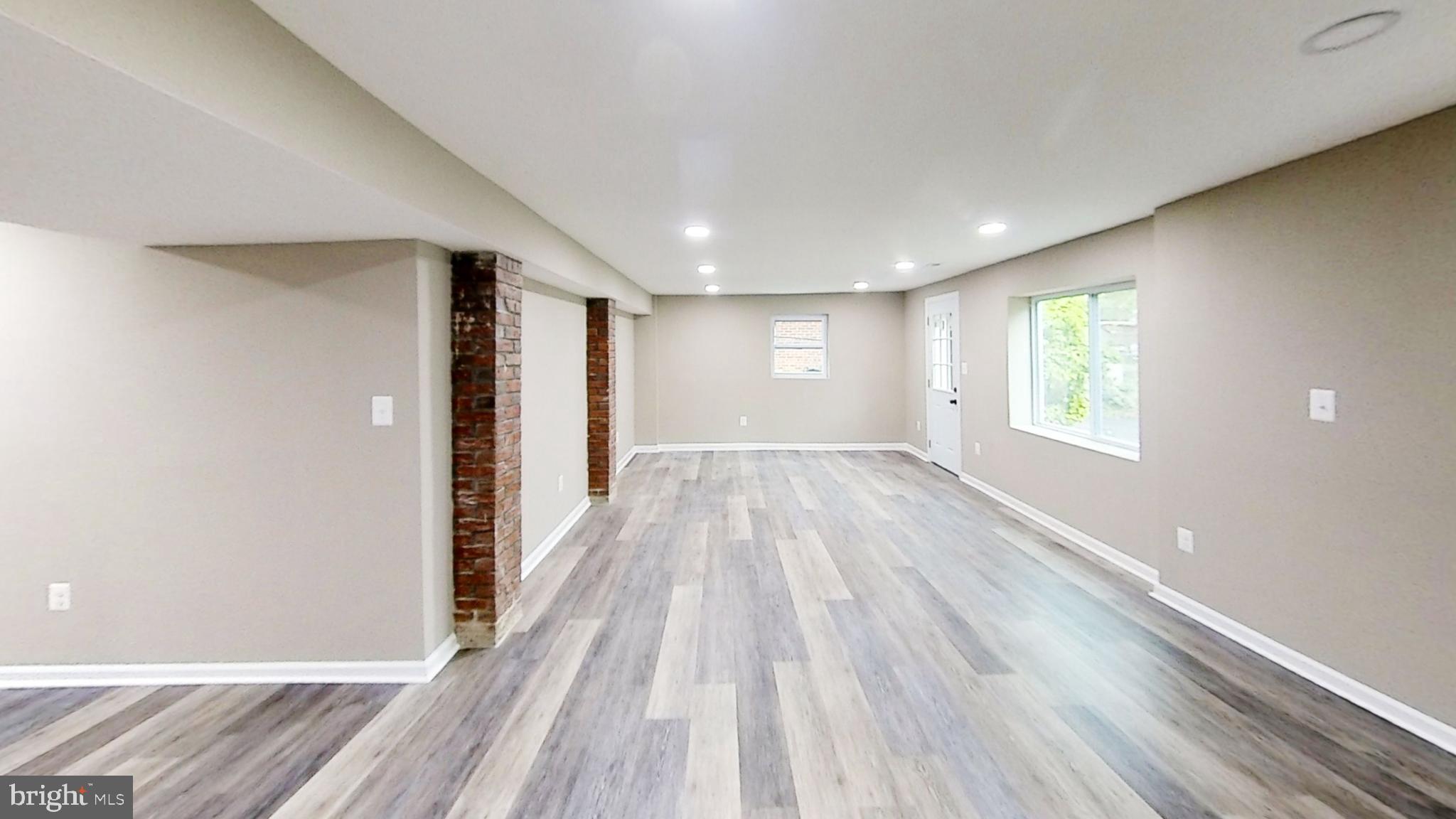 5611 Berwyn Road Berwyn Heights, MD 20740 - Photo 19 of 27 Open basement, laminate floors, walk-out to