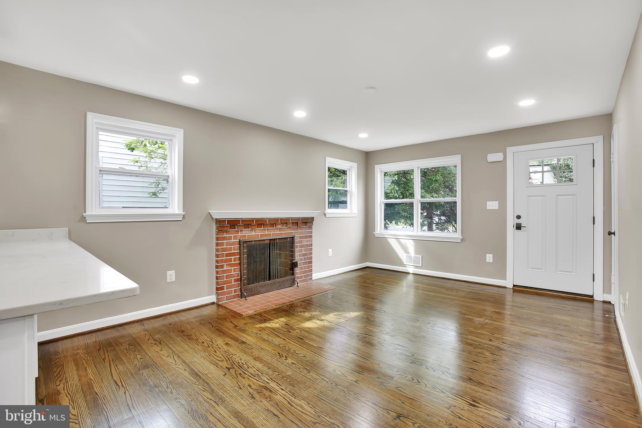 5611 Berwyn Road Berwyn Heights, MD 20740 - Photo 5 of 27 Living room with warm fireplace