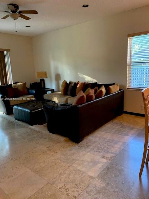 a living room with furniture and a window