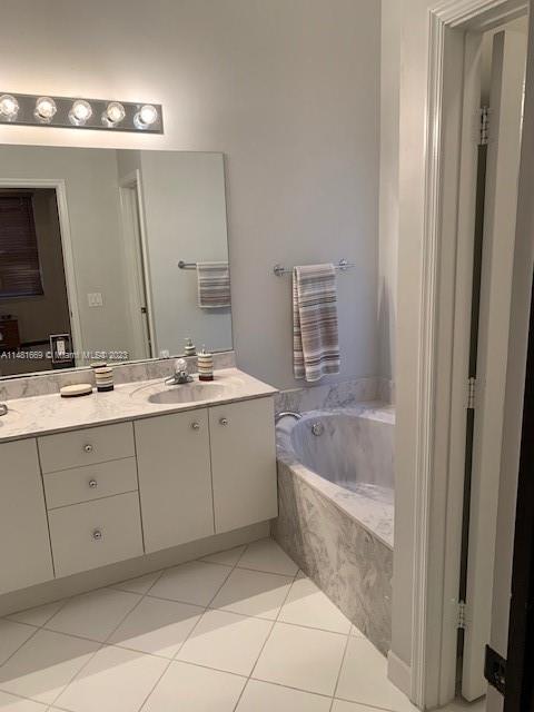 Savanna Weston, FL 33327 - Photo 2 of 9 a bathroom with a tub a sink and mirror