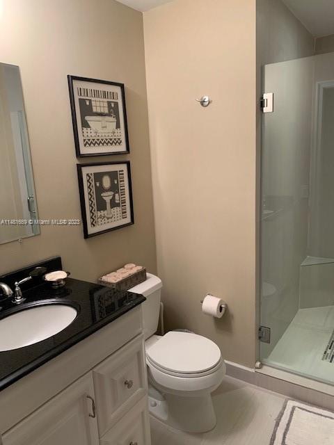 Savanna Weston, FL 33327 - Photo 3 of 9 a bathroom with a granite countertop toilet a sink and mirror