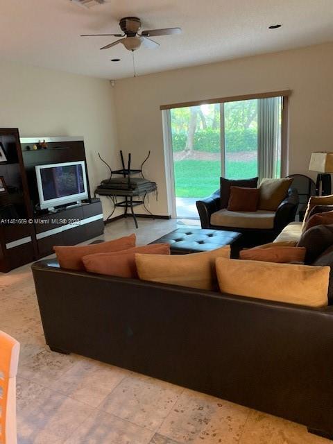 Savanna Weston, FL 33327 - Photo 8 of 9 a living room with furniture and a large window