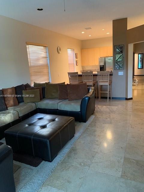 Savanna Weston, FL 33327 - Photo 9 of 9 a living room with furniture and a flat screen tv