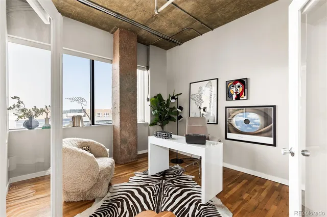 a bedroom with a bed and a mirror