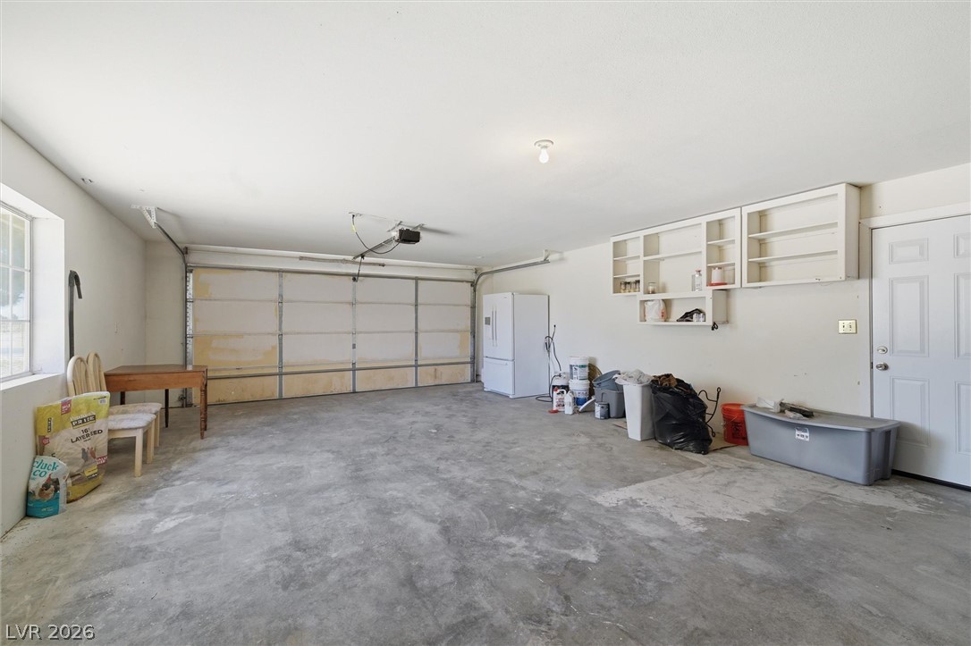 2780 West Simkins Road Pahrump, NV 89060 - Photo 21 of 40 A spacious, well-lit garage offers ample storage and direct home access.