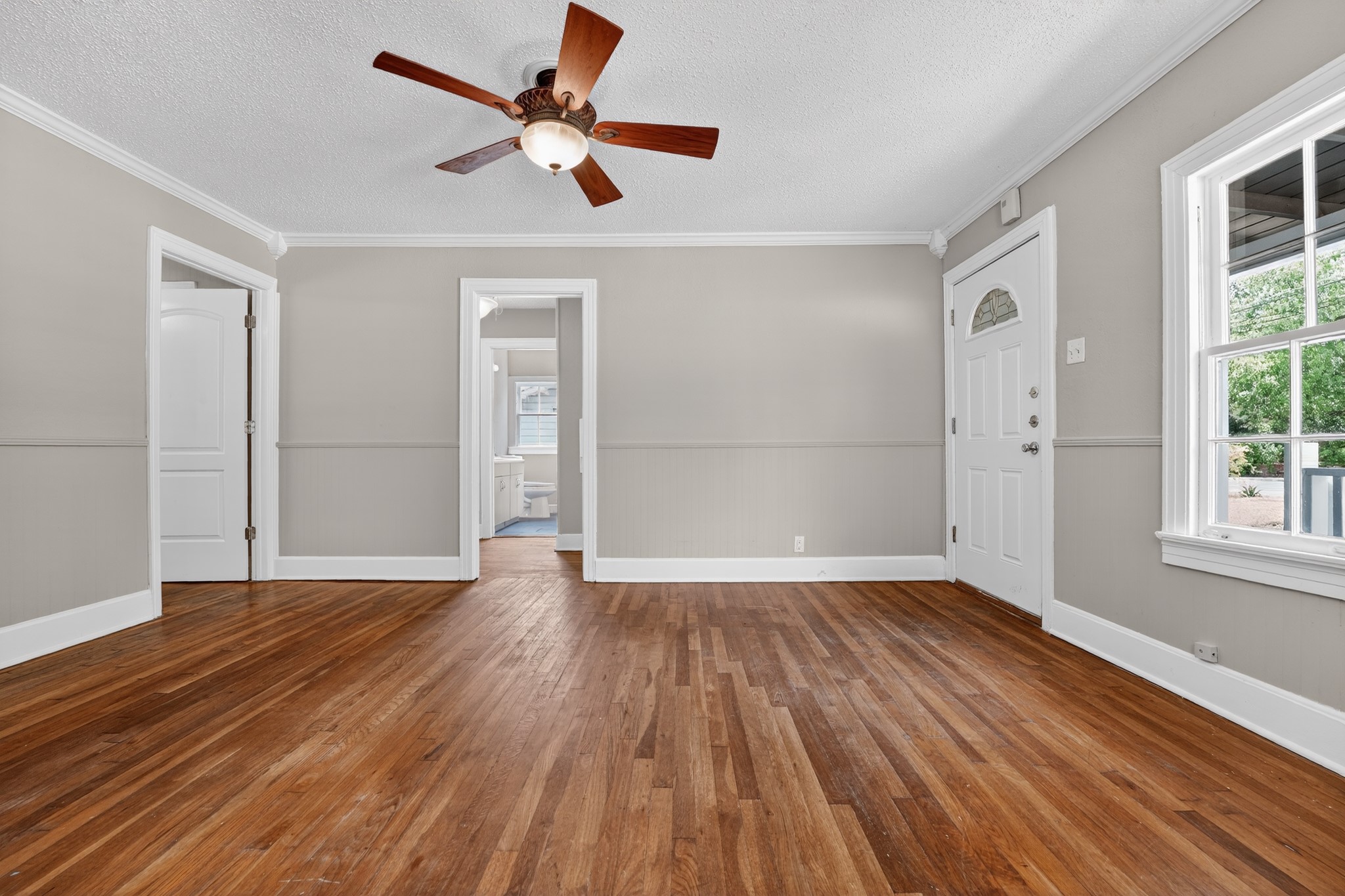 4907 Duval Street Austin, TX 78751 - Photo 28 of 31 an empty room with wooden floor and windows