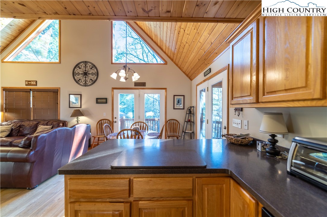 893 Deerwood Road Piney Creek, NC 28663 - Photo 19 of 50 a view of a dining room with furniture and chandelier
