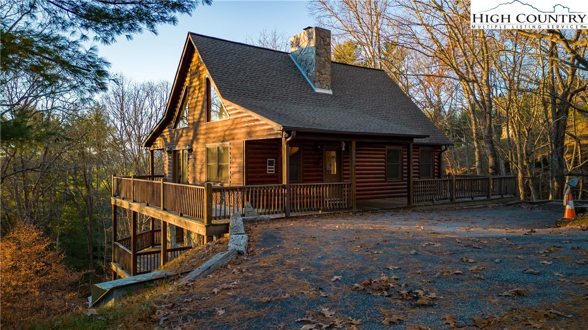 893 Deerwood Road Piney Creek, NC 28663 - Photo 2 of 50 a view of a house with backyard