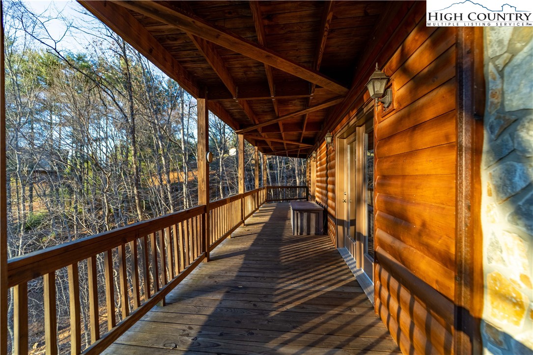 893 Deerwood Road Piney Creek, NC 28663 - Photo 42 of 50 a view of outdoor space with wooden deck
