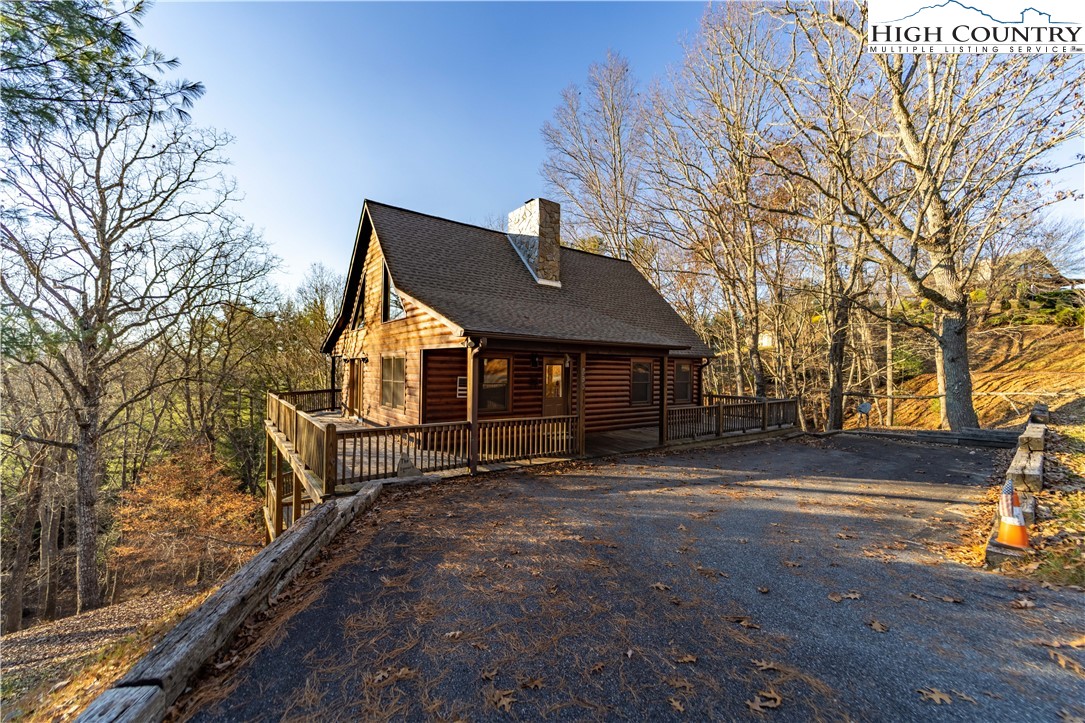 893 Deerwood Road Piney Creek, NC 28663 - Photo 50 of 50 a front view of a house with a yard