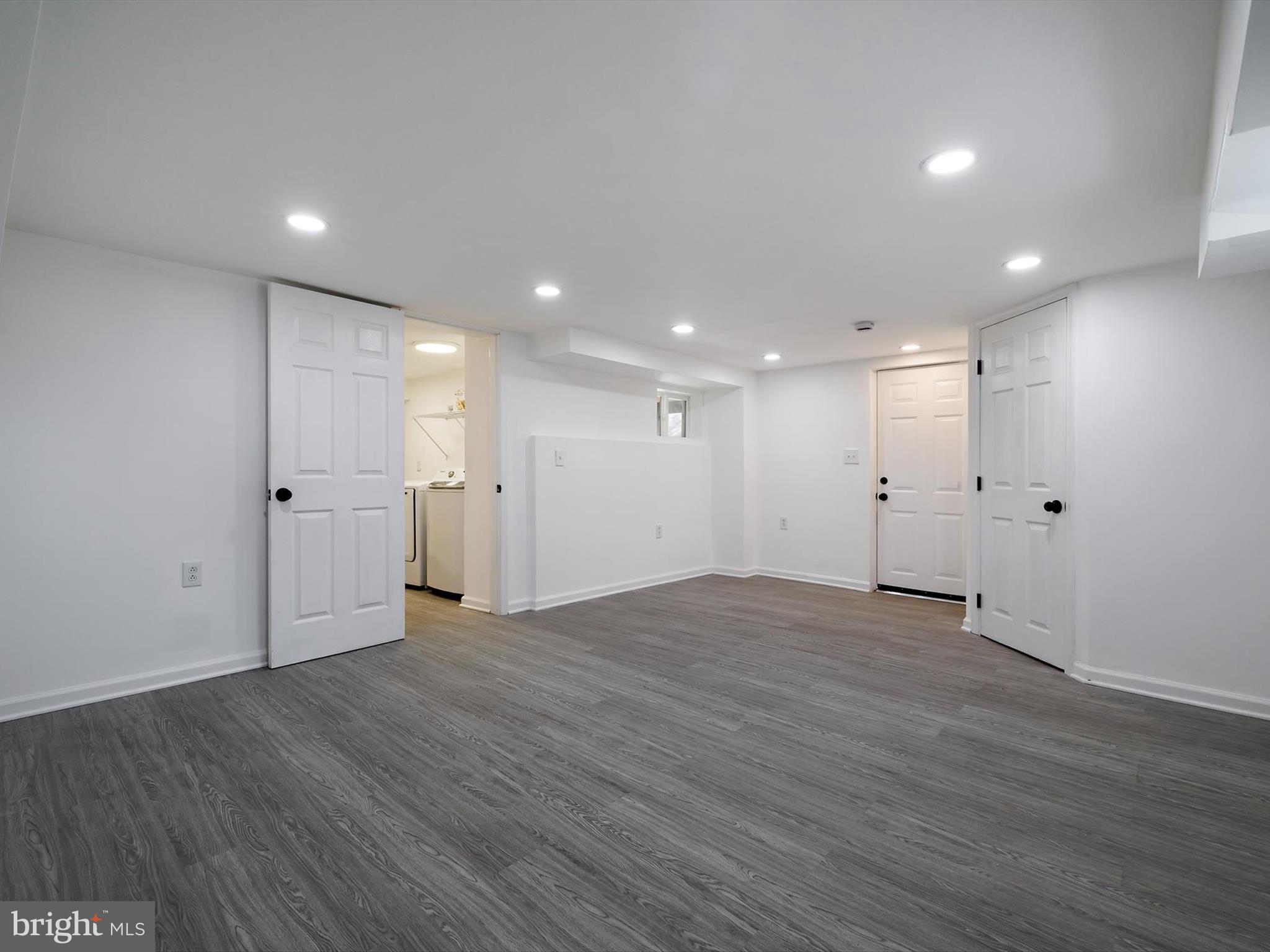 10109 Lorain Avenue Silver Spring, MD 20901 - Photo 32 of 48 a view of an empty room with wooden floor