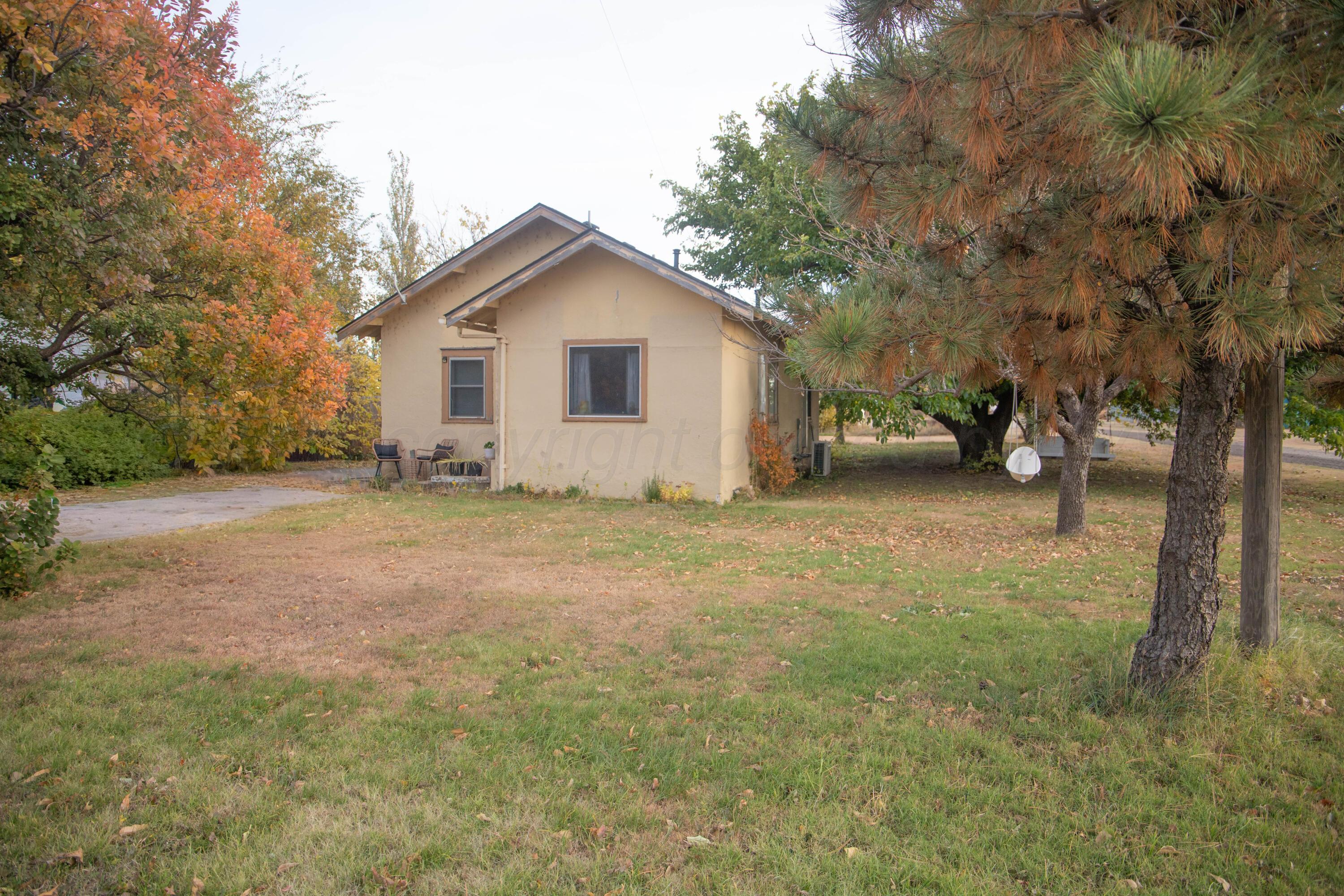 300 East Broadway Street Panhandle, TX 79068 - Photo 3 of 23 a view of a house with a yard
