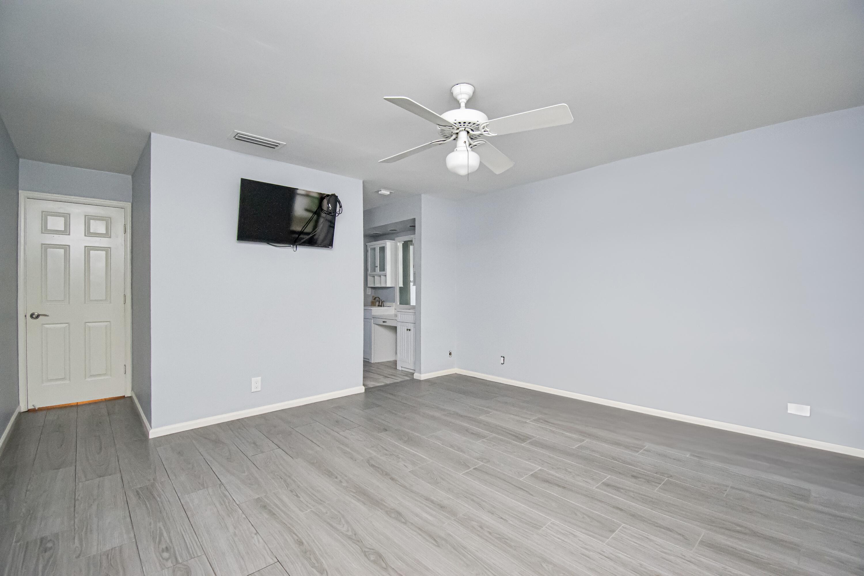 7706 Solimar Circle Boca Raton, FL 33433 - Photo 16 of 28 a view of a livingroom with a flat screen tv