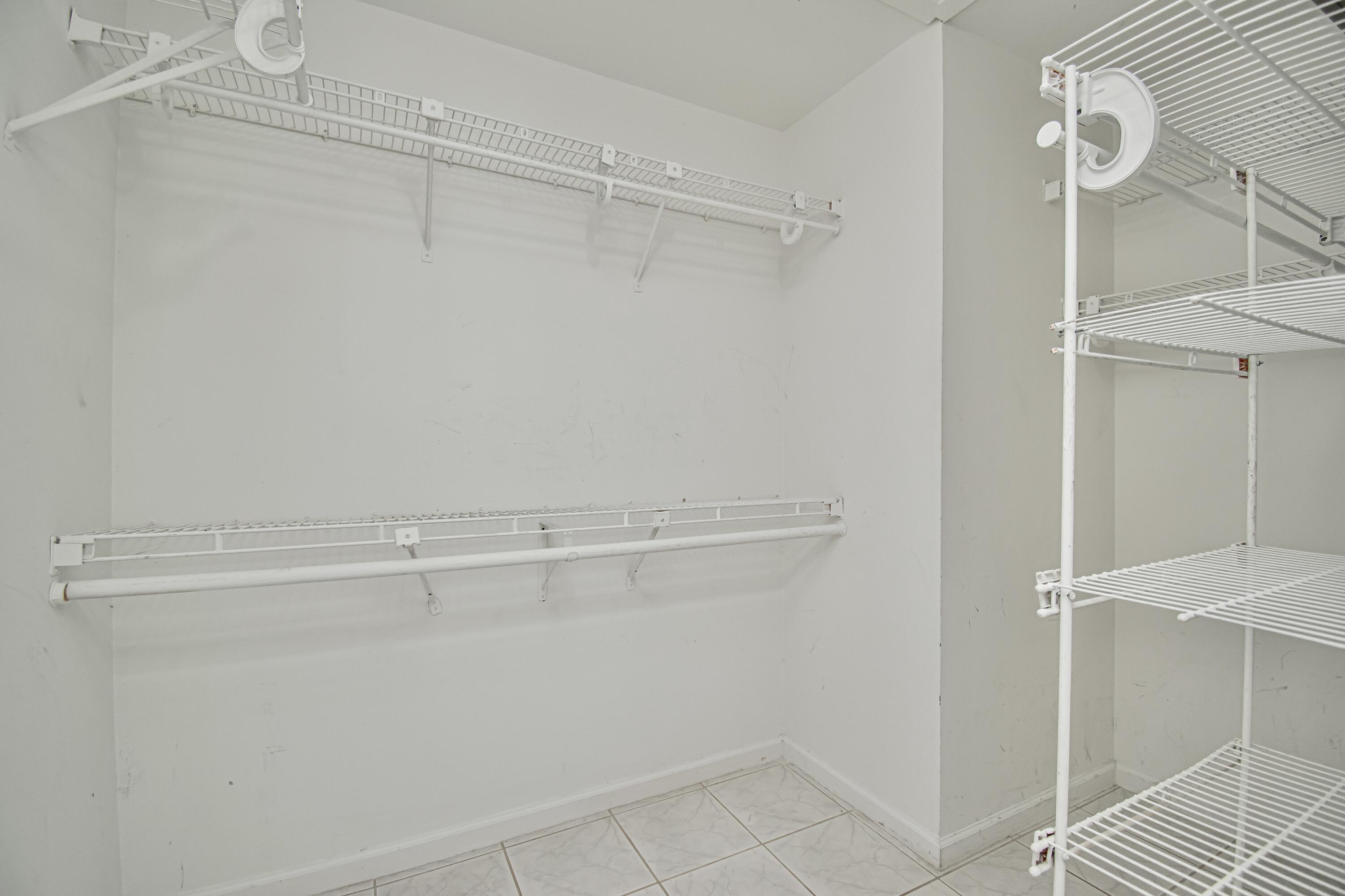 7706 Solimar Circle Boca Raton, FL 33433 - Photo 17 of 28 a view of a room with racks on the wall