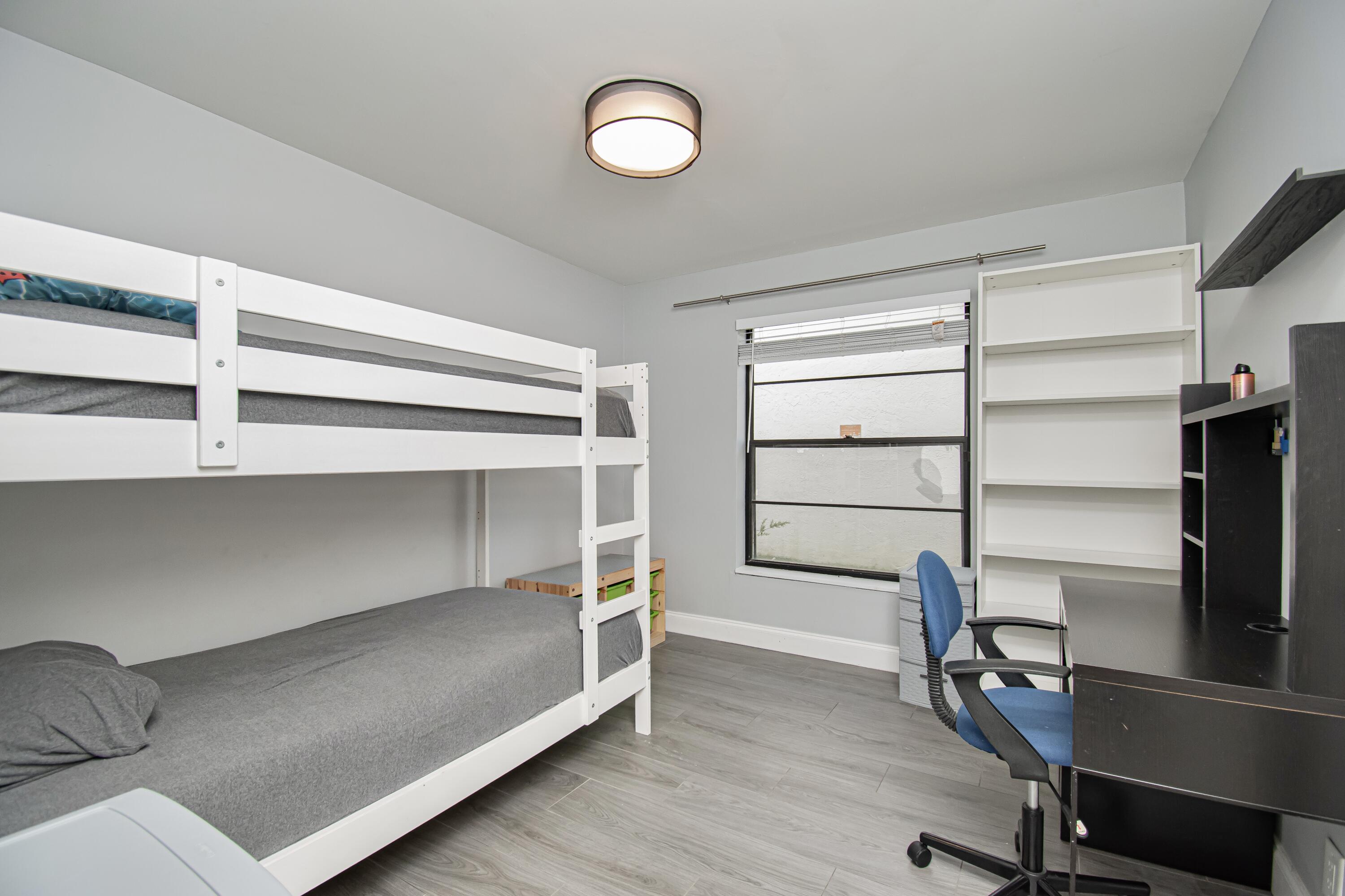 7706 Solimar Circle Boca Raton, FL 33433 - Photo 20 of 28 a living room with a furniture and a window