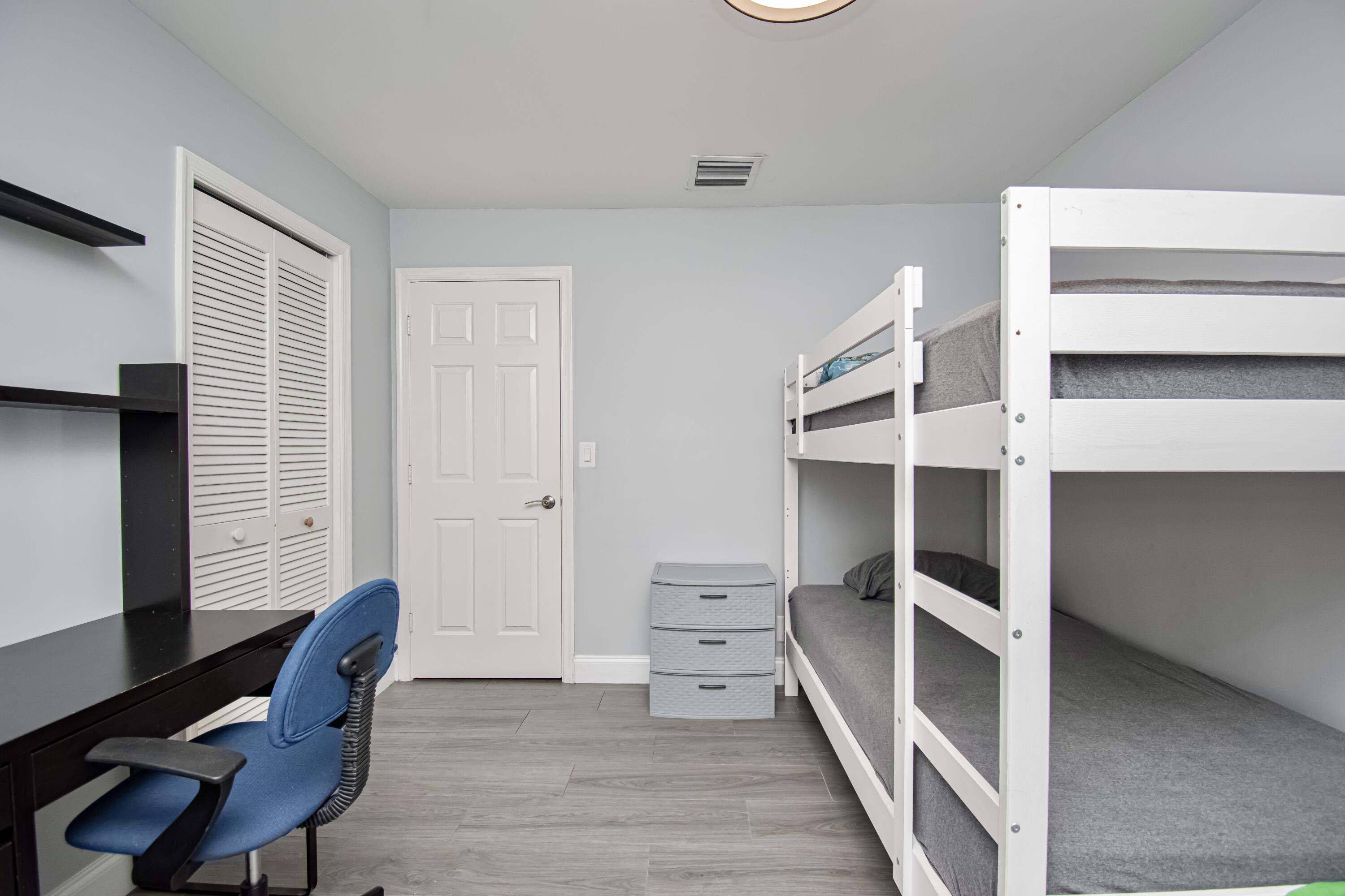 7706 Solimar Circle Boca Raton, FL 33433 - Photo 21 of 28 a view of bedroom with furniture and wooden floor