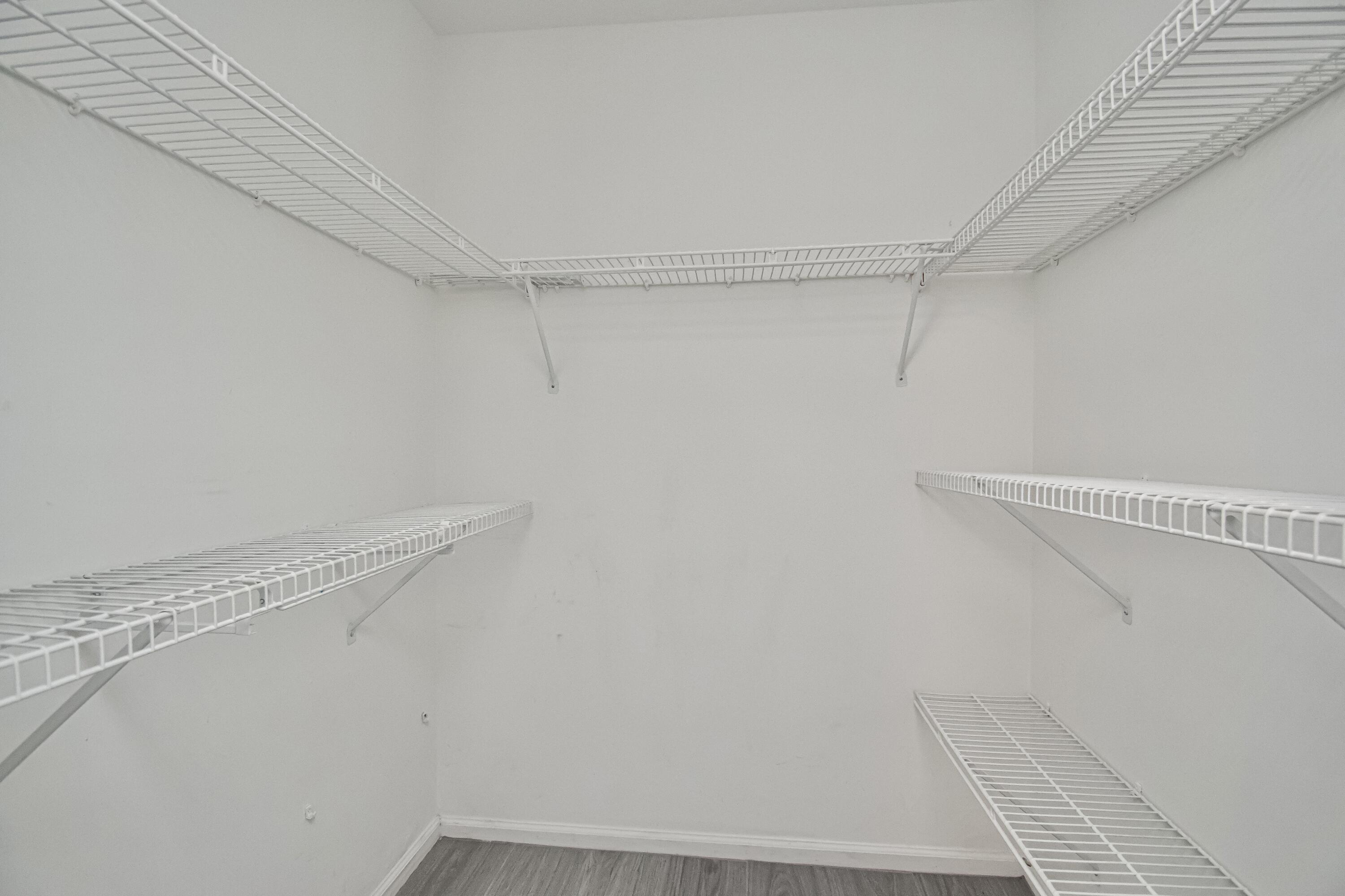 7706 Solimar Circle Boca Raton, FL 33433 - Photo 22 of 28 a view of a room with racks on the wall