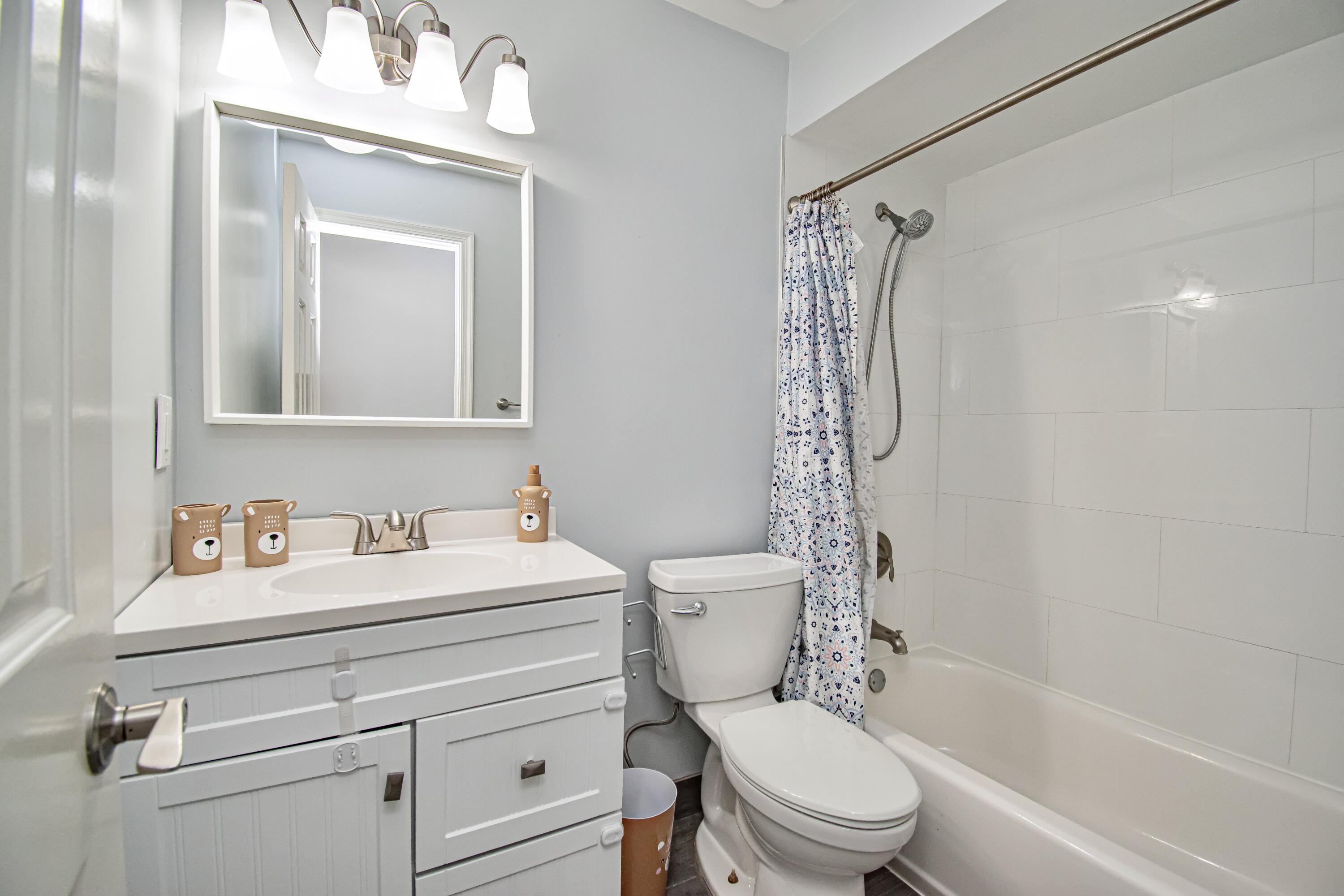 7706 Solimar Circle Boca Raton, FL 33433 - Photo 23 of 28 a bathroom with a sink a toilet and shower
