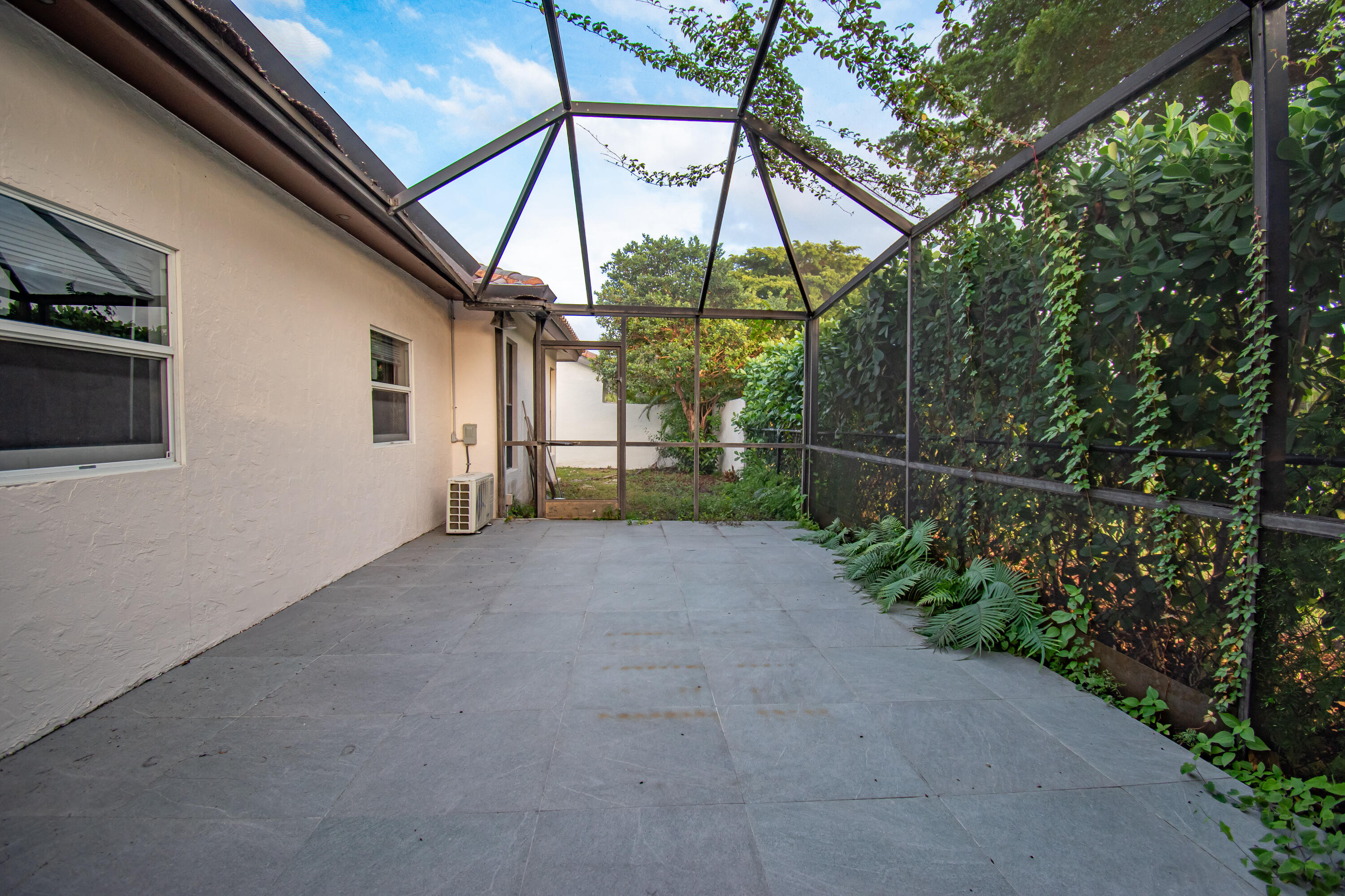 7706 Solimar Circle Boca Raton, FL 33433 - Photo 27 of 28 a view of a house with a street