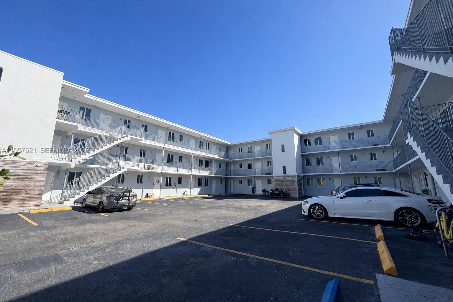 540 Northwest 7th Street, Unit 32 Miami, FL 33136 - Photo 5 of 6 a car parked on the side of a street