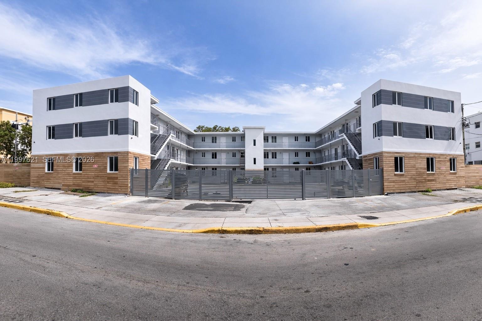 540 Northwest 7th Street, Unit 32 Miami, FL 33136 - Photo 6 of 6 a view of large building with a street