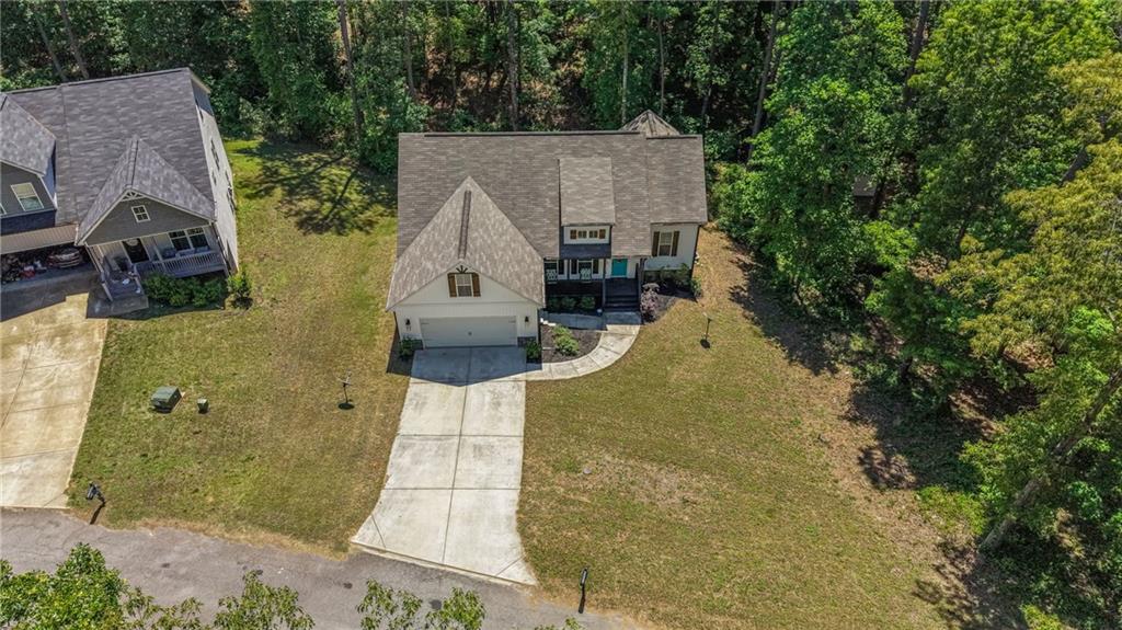 30 Buffelhead Court Monticello, GA 31064 - Photo 29 of 37 an aerial view of a house with swimming pool and large trees