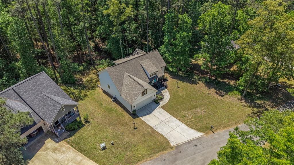 30 Buffelhead Court Monticello, GA 31064 - Photo 30 of 37 an aerial view of a house with swimming pool and a yard