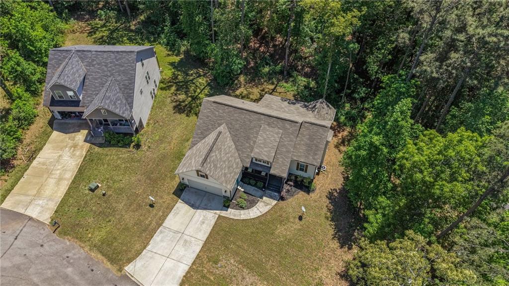 30 Buffelhead Court Monticello, GA 31064 - Photo 31 of 37 an aerial view of a house with swimming pool and large trees