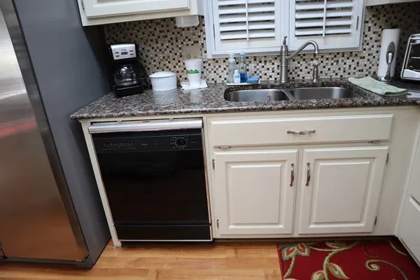 a bedroom with a bed couch and a window