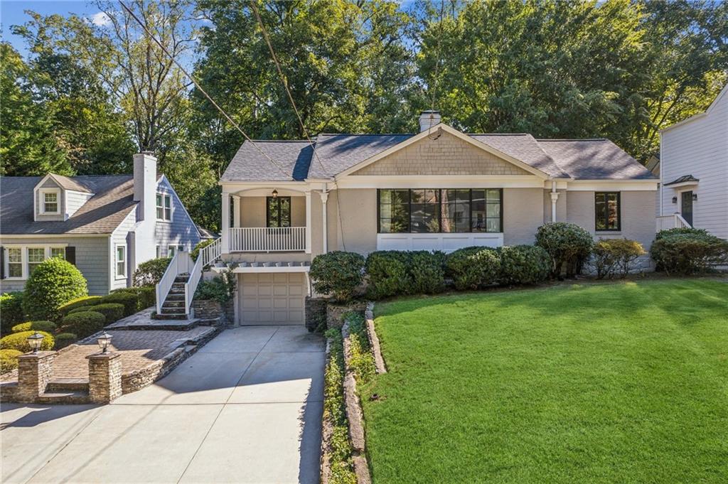 4043 North Ivy Road Northeast Atlanta, GA 30342 - Photo 1 of 1 a front view of a house with garden