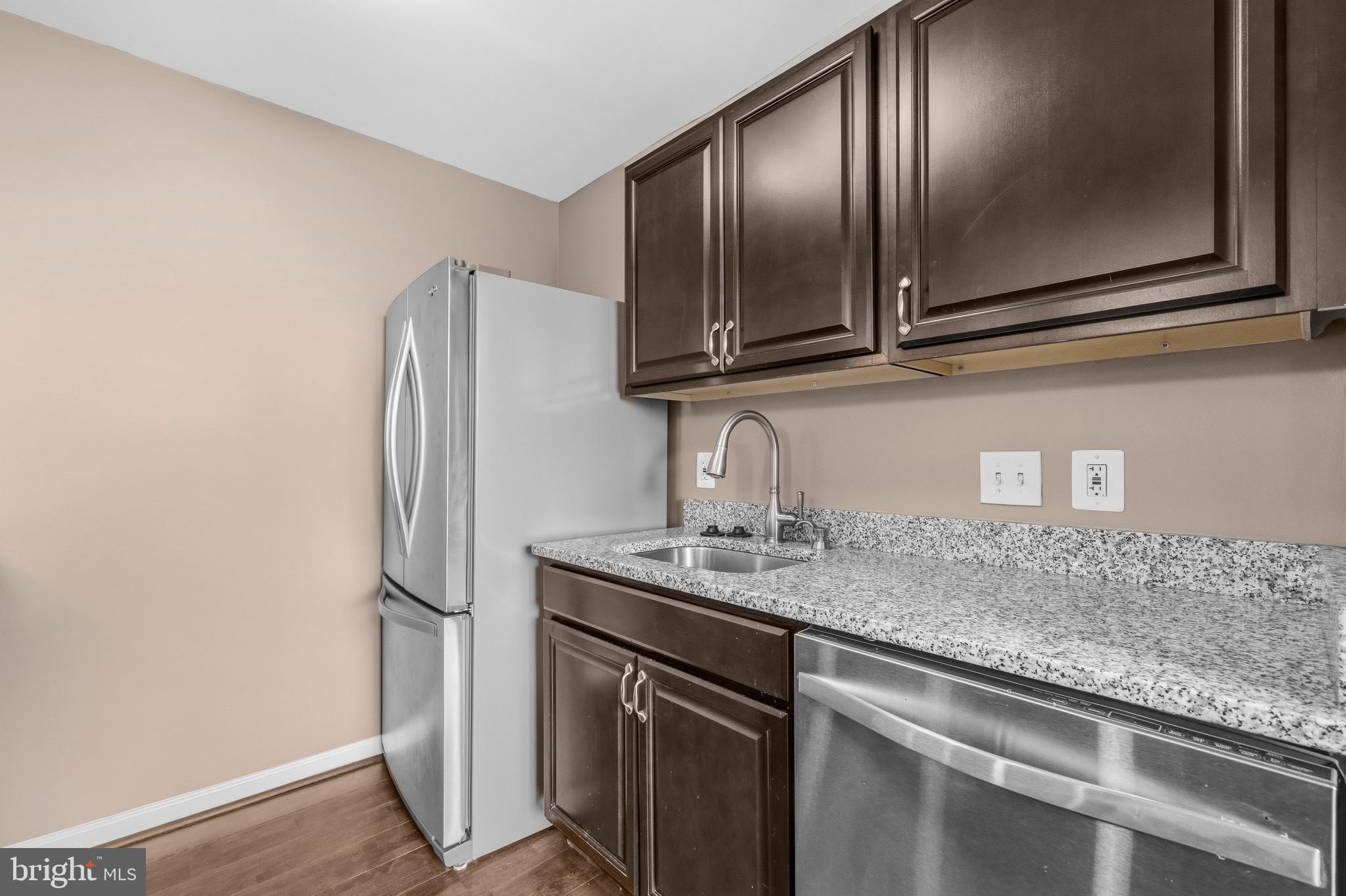 3902 14th Street Northwest, Unit 321 Washington, DC 20011 - Photo 13 of 21 a kitchen with stainless steel appliances granite countertop a refrigerator and a sink